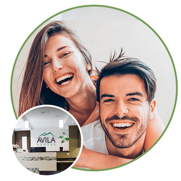 Man and woman smiling with Avila Dental office.